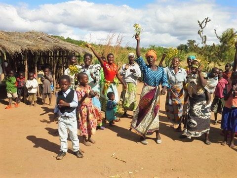 happy mothers of kindergarten children in rural Malawi welcome representatives of Project Kindy in Brisbane Australia