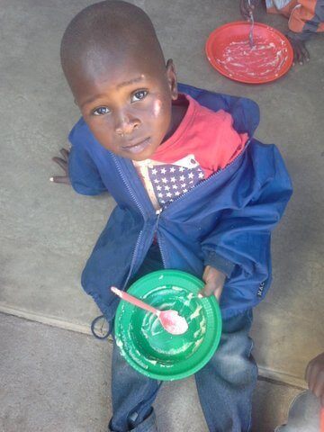 Little boy has finished his daily lunch at kindergarten thanks to Project Kindy donors in Brisbane