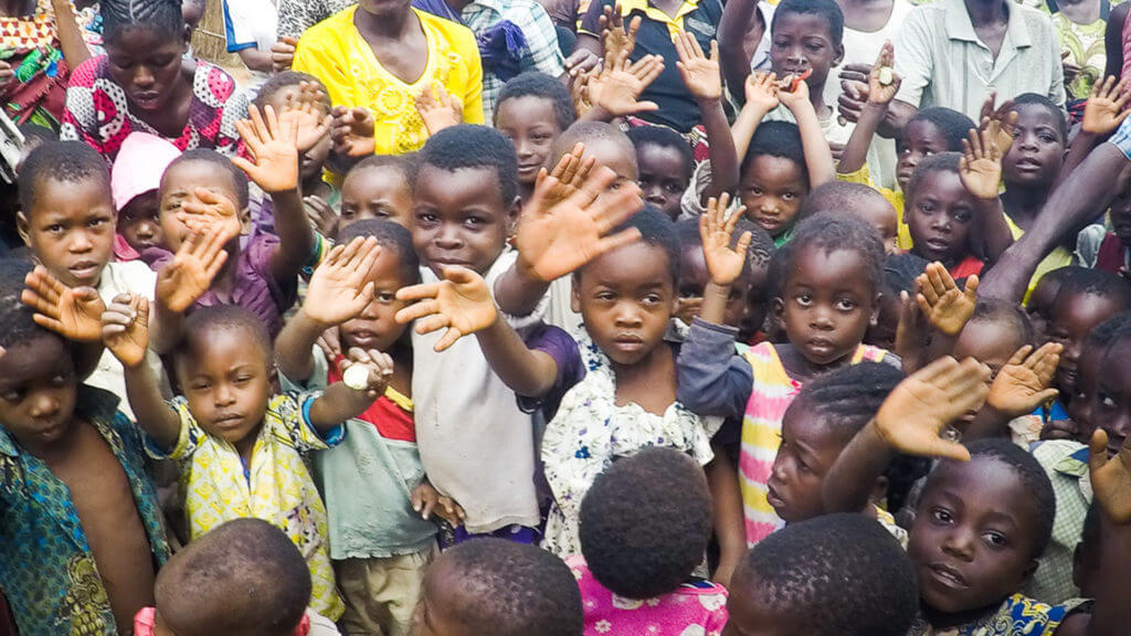 project kindy children waving to donors